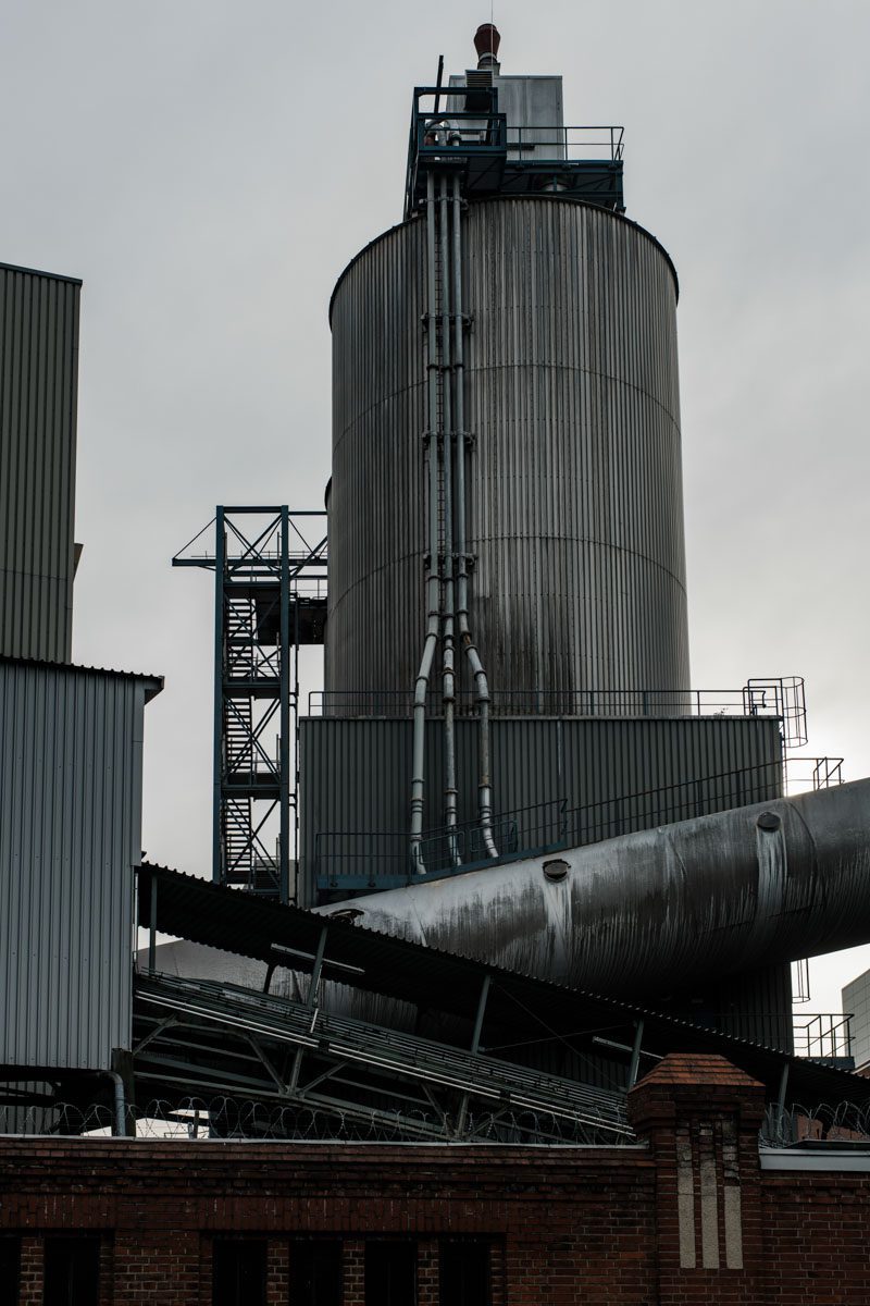 a large metal tower with pipes