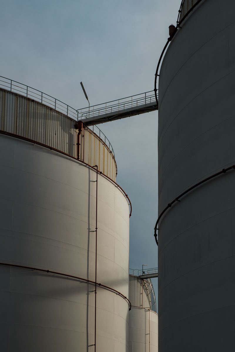 a large white silos with a railing