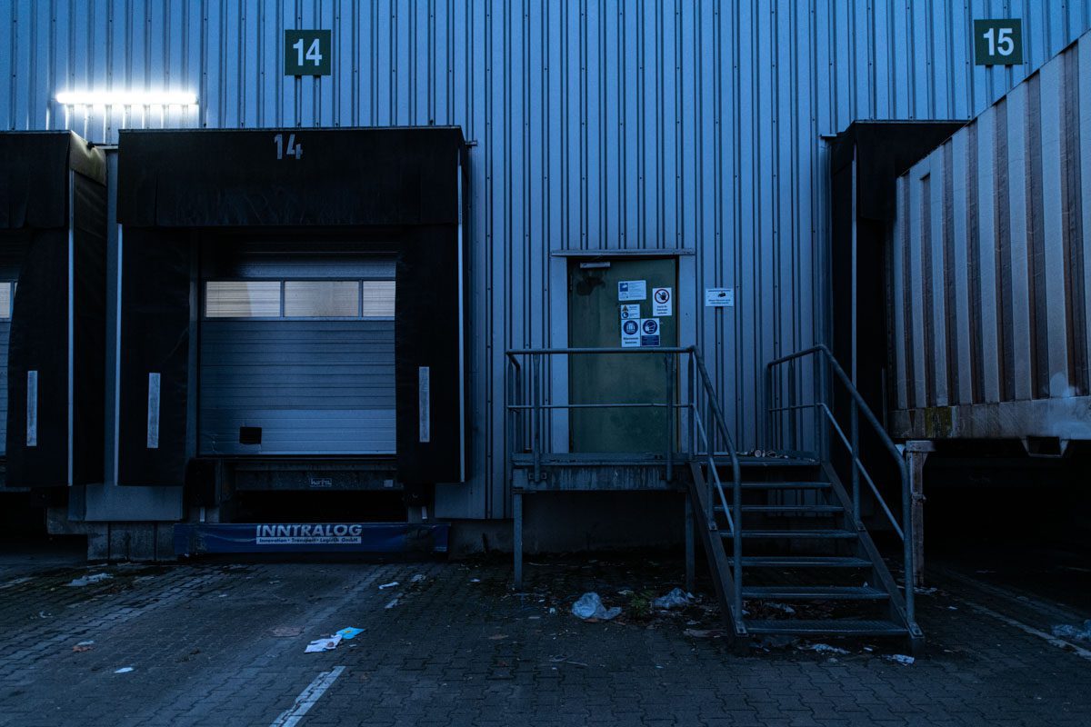 a metal building with a staircase and a door