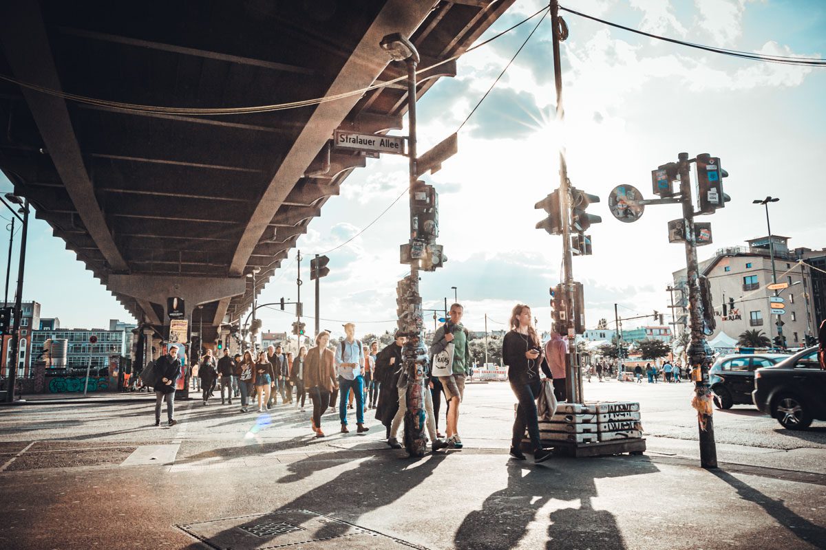 a group of people walking on a street