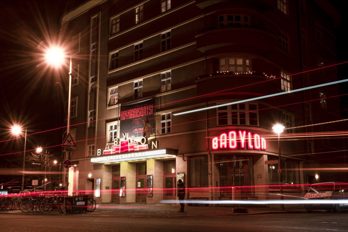 a building with red lights at night