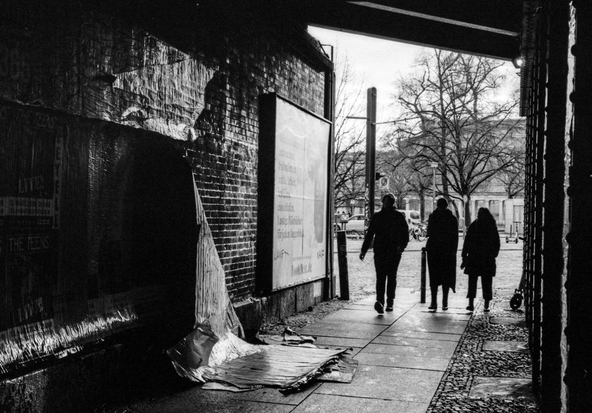 people walking on a sidewalk